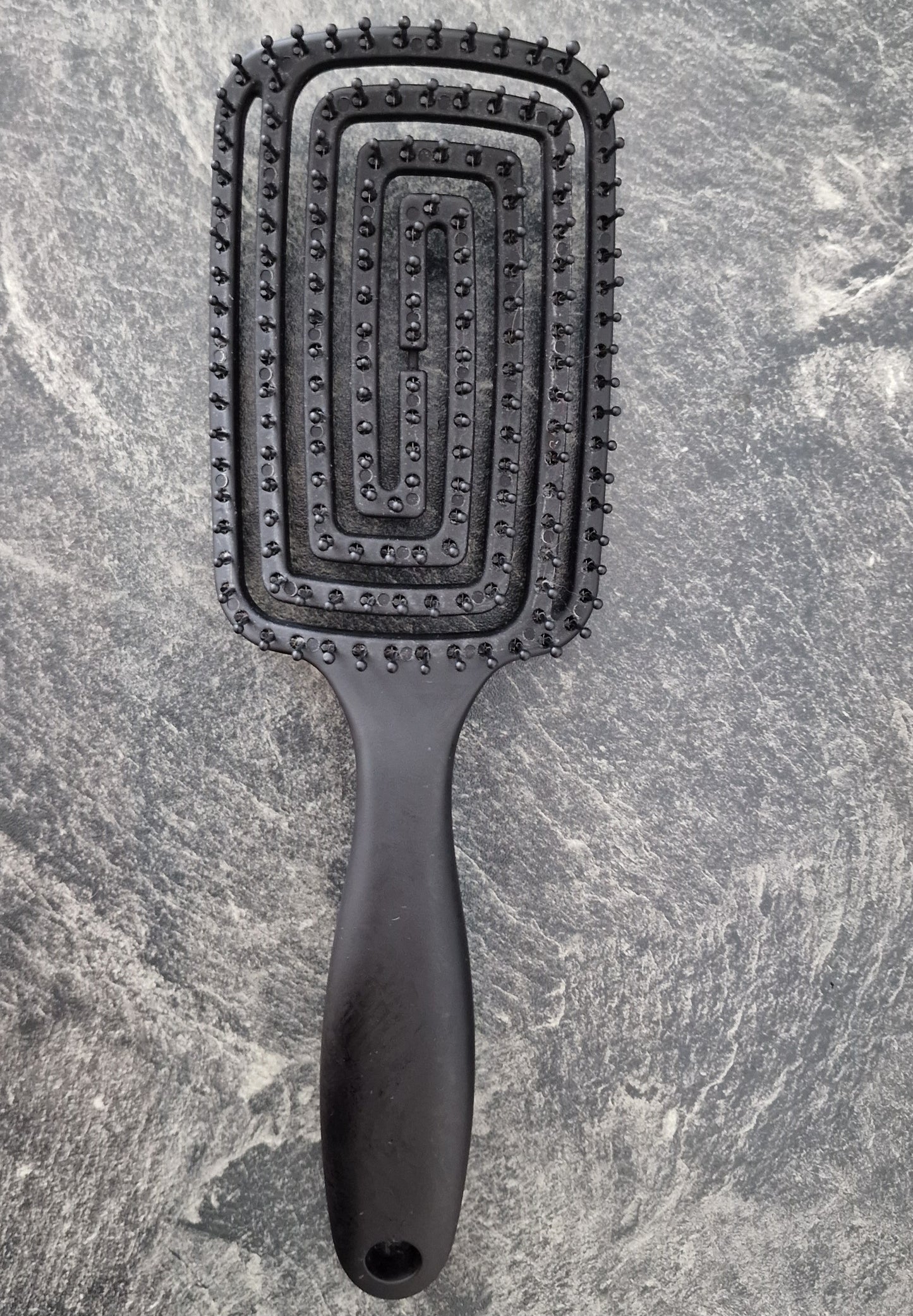 This Hair Brush offers an optimal grooming experience with its combination of bristles and ergonomic design